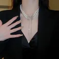 Elegant double-row pearl necklace with a large sparkling rhinestone butterfly pendant - Style 20