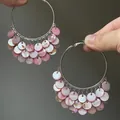 Detail showing pink pearlescent shell discs on large silver hoop earrings for beach - Silver Earring Post Style / Silver-Pink