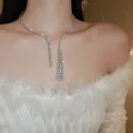 Sparkling zircon water drop choker necklace worn by a model in elegant white outfit - Water Drop Tassel Choker (11#) / Silver