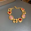 Vintage gold-plated palace style bracelet featuring red heart gems and elegant cameo portraits - 22# Bracelet