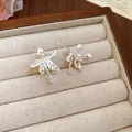 Elegant silver-tone flower stud earrings with sparkling zircon in a velvet jewelry box - Clip-on Style / One Pair / Silver