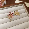 Exquisite 18k gold plated flower stud earrings featuring zircon accents in red and gold finish - Clip-on Style / One Pair / Gold-Red