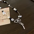 French style silver bow pendant necklace with elegant pearl and black bead accents - Necklace Style 29 / Silver