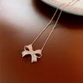 Elegant sparkling bow pendant necklace with full diamond-like stones on a silver chain - Necklace Style 32 / Silver