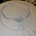 Elegant silver-toned rhinestone butterfly pendant necklace with sparkling dangling tassels - Style 38 (Tassel)