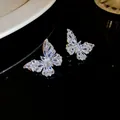 Macro view of sparkling butterfly stud earrings featuring marquise-cut cubic zirconia stones - 25# Silver Needle Earrings - Silver with Rhinestone Butterfly