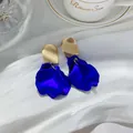 Elegant Klein blue rose petal drop earrings with gold textured finish for women - Rose Petal Drop Earrings