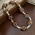 Vintage Goldkette mit schwarzen Emaille-Gliedern und bernsteinfarbenen Kristallen - Halskette / Braun
