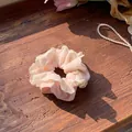 Elegant pink and cream lace scrunchie featuring delicate floral embroidery on wood - Pink