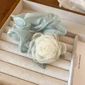 Elegant light blue chiffon hair scrunchie featuring a delicate white lace flower embellishment - Green