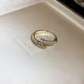 Macro detail of a luxury gold serpent wrap ring encrusted with sparkling zircon stones - Snake Style (1戒指)