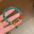 Detailed view of a New Chinese style agate and jade beaded bracelet with gold charms - Style 73 Sugar Heart Agate (With Gift Box) / Green