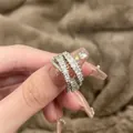 Elegant silver crossover ring set with sparkling zircons on a soft textured background - Multi-Layer Cross Style (5戒指)