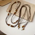 Detail of Bohemian multi-layer hemp rope belt with natural wooden beads and woven texture - 2# Waist Chain