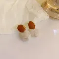 Close-up of Maillard style brown resin drop earrings with marbled white sphere beads - Hoop Amber Style (12#)