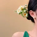 Detailed close-up view of a sweet fabric flower hair clip styled on a model's hair - Hair Stick (8#) / Green
