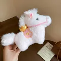Detailed macro view of the soft pink plush horse keychain featuring a decorative golden ingot - Charm / Pink