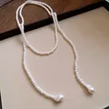 Elegant long pearl sweater necklace featuring teardrop-shaped baroque pearls on a tray. - Baroque Irregular Pendant Style / White