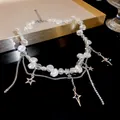Detailed view of elegant pearl necklace with star pendants and crackle beads for women - Pearl Star Tassel Style (HN3515) / Silver