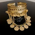 Close-up of gold coin tassel open cuff bracelet with intricate geometric patterns - Armlet (HB2313) / Gold