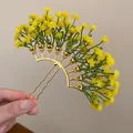 Detail showing yellow Gypsophila flower hair stick with golden U-pin base - Yellow