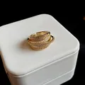 Close-up detail of the sparkling zircon arrangement on a gold-plated multi-layer open ring - Multi-layer Geometric Style (HR769) / Gold