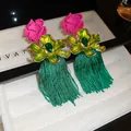 Exquisite macro shot of vintage-style floral earrings featuring green tassels and pink blooms - Pink Flower Enamel Green Tassel
