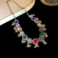 Detail view of vintage court style necklace with colorful rhinestones and floral pendants - Necklace / Silver