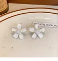Elegant silver needle flower stud earrings with white enamel petals and pearl center. - Drip Glaze Artificial Pearl Flower (45#) / White