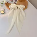 Elegant white fabric bow hair clip with long ribbons in creamy silk finish for women. - Spring Clips / Beige