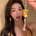 Vibrant yellow floral tassel earrings in dopamine style with silver needles for fashion women. - Yellow Multi-layer Flower Tassel Style (20#) - Earring Hook / Yellow