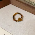 Elegante anello di perline occhio di tigre con pietra a cuore e dettagli dorati - Stile 18 / Marrone