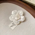 Detailed view of cream resin flower hair clip with pearlized finish and square center - Flower Style (7#)