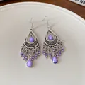 Close-up of bohemian purple teardrop tassel earrings with vintage silver metal finish - Purple (Ear Hook-Silver-Purple)