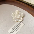 Close-up of elegant cream resin flower hair clip with pearl-like texture - Flower Style(4#)