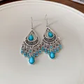Detail shot of Bohemian style teardrop tassel earrings featuring blue rhinestones and stones - Blue (Ear Hook-Silver-Blue)