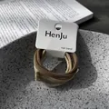 Macro view of high-elastic minimalist hair bands in earth tones on HenJu hangtag - 6 Pieces Set / Three Colors