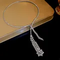 Macro view of elegant rhinestone zircon tassel necklace featuring a floral cluster detail - Long Tassel Choker / Silver