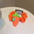 Vibrant orange elastic scrunchie hair tie featuring a cute 3D silicone carrot charm detail - Carrot Flower Style