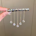 Close-up of elegant crystal fringe hair clip with dangling teardrop pendants - Spring Clip-Transparent