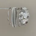 Silver four-piece set of irregular metal bangles with hammered texture - Four-Piece Set / Silver