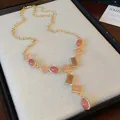 Vintage geometric stone necklace with crystal accents on a gold-tone chain for women. - Style 56 Necklace