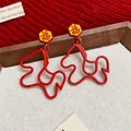 Red oil-drop pony earrings with Chinese Fu character in a traditional festive style. - Hollow Pony Style / Red