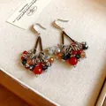 Close-up of bohemian earrings with red and black crystal clusters and silver hooks. - Bohemian Ethnic Style (HE25854) / Multicolor Combo