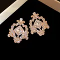 Vintage French court style gold earrings with intricate hollow geometric rhinestone patterns - Gold