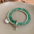 Elegant handmade elastic bracelet with translucent green beads and silver Fu luck charms - Style 114 Silver Green (Blessing)