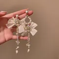 Elegant asymmetric shimmering crystal and pearl tassel earrings with beige ribbon bows - Cream White Bowknot Tassel (6#)
