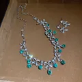 Vintage bowknot necklace and earring set with elegant green teardrop rhinestones - Necklace and Earring Set / Silver-Green