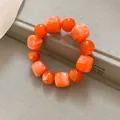 Close-up of orange marbled acrylic bracelet with alternating square and round beads - 3# / Orange