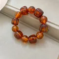 Detailed close-up of amber acrylic marbled bracelet featuring square and round beads - 4# / Dark Coffee